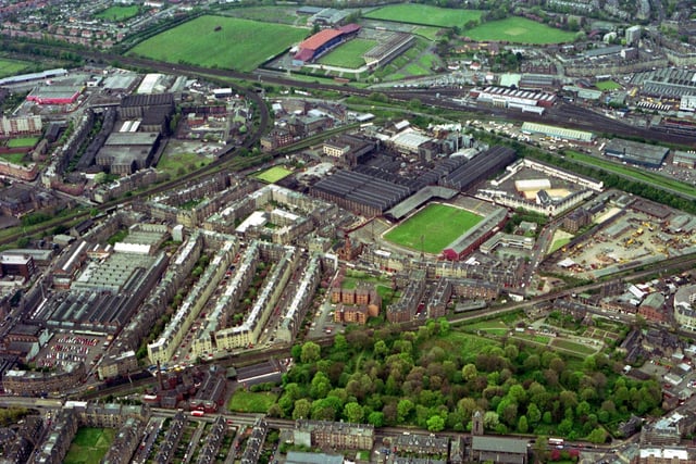 Aerial photograph of the Slateford/Roseburn and Gorgie/Dalry areas of Edinburgh, May 1991. Looking north west, the picture shows Murrayfield rugby ground (top middle) Tynecastle football ground (middle), and the Western Approach Road.