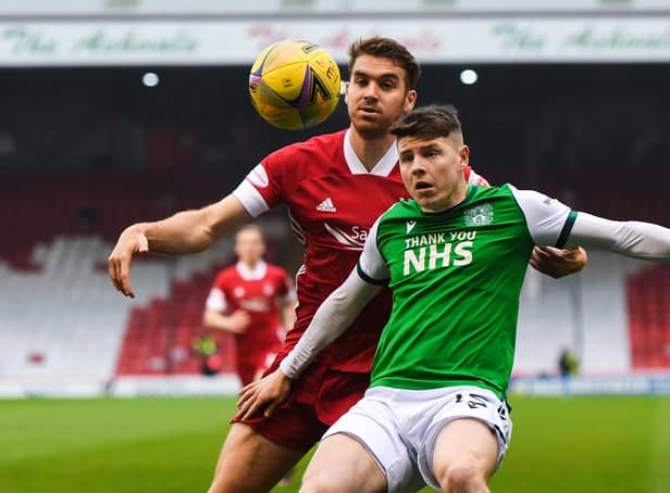 Hibs' Kevin Nisbet (right) holds off Tommie Hoban of Aberdeen