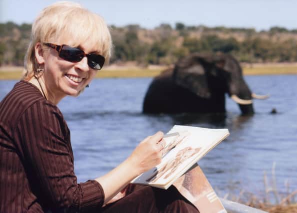 Carol Barrett at the Chobe River, which marks the border between Botswana and Namibia