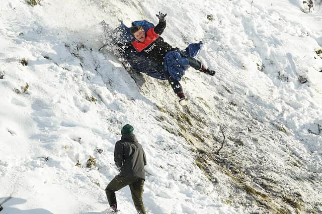 Many people jumped at the chance to take to the slopes after heavy snow fell on Edinburgh (Picture: Jeff J Mitchell/Getty Images)