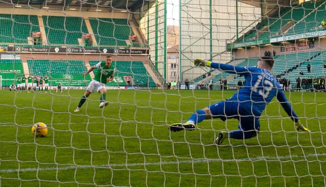 Ryan Porteous tucks away the winning penalty to send Hibs into the Scottish Cup semi-finals. Picture: SNS