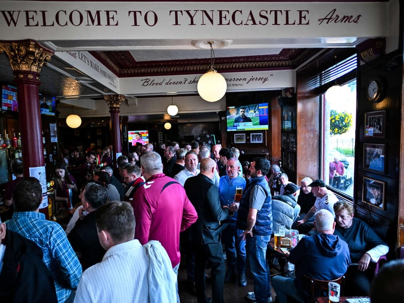 Hearts fans have pre-match drinks in the Tynecastle Arms  (Photo by ANDY BUCHANAN / AFP via Getty Images)