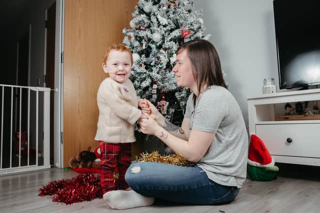 Christmas angel: Little Emily and mum Kirsty Myles