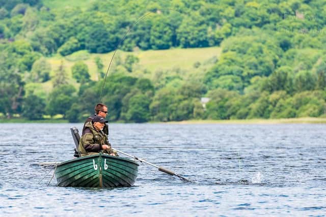 Ben Robertson, top, lands a fish during competition.