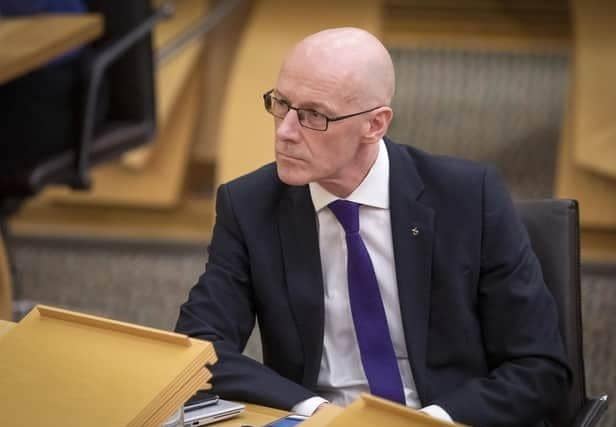 Deputy First Minister John Swinney appears to wear Scotland's higher taxes as a badge of pride (Picture: PA)
