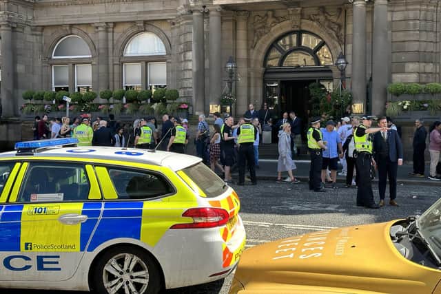 Police dealing with the crowds of Bruce Springsteen fans who gathered outside The Balmoral on Tuesday afternoon, ahead of his concert at BT Murrayfield