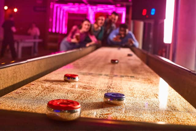 Boom Battle Bar's commitment to shuffleboard is unrivalled and revellers can play at the new Edinburgh venue.
