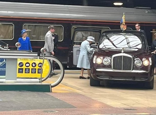 The Queen, dressed in a powder blue silk wool coat and dress, was spotted by excited rail passengers in Edinburgh Waverley on Monday. (Photo credit: Mick Kendrick)