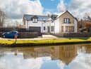 This detached villa enjoys an idyllic setting on the banks of the Union Canal, right in the heart of the desirable village of Ratho.