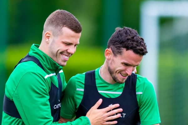 Florian Kamberi shares a joke with Paul McGinn during a first-team training session at Hibs' East Mains base