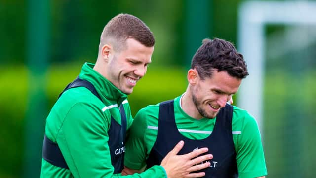 Florian Kamberi shares a joke with Paul McGinn during a first-team training session at Hibs' East Mains base