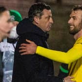 Jack Ross congratulates Christian Doidge after the Hibs striker scored twice against Queen of the South.
