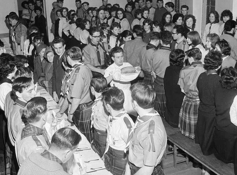 Attendees wait excitedly for their dinner as the haggis is brought in, at the Edinburgh and Leith Rover Scouts and Rangers Burns Supper in 1964.
