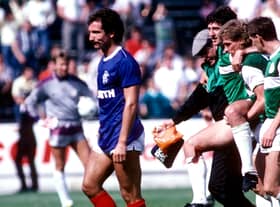 Graeme Souness leaves the field on his Rangers debut after receiving a red card for a challenge on Hibs' George McCluskey, who is helped off the pitch, on the opening day of the 1986/87 season.