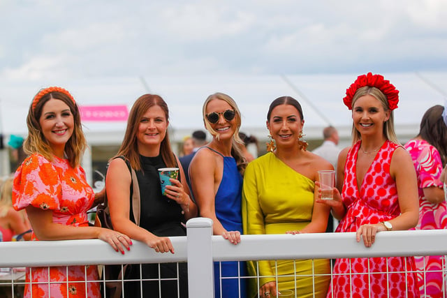 Summer was in full swing as this colourful crowd arrived at the racecourse.