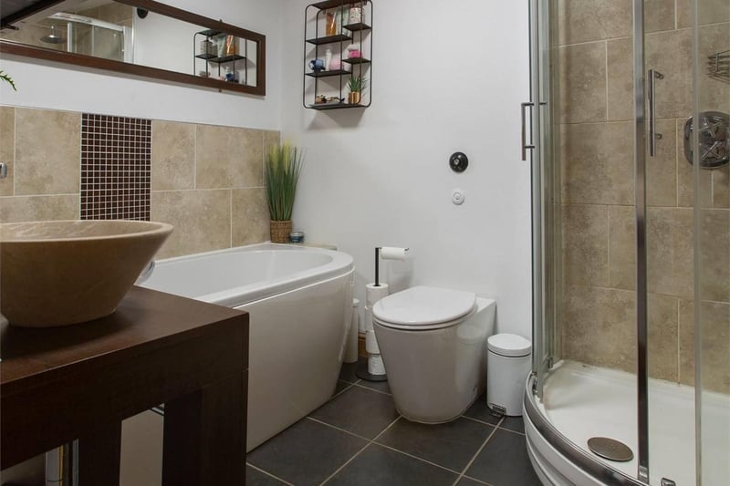 The bathroom is fitted with a white four-piece suite and separate shower. The corner shower is powered by the gas combi boiler, ensuring great water pressure.