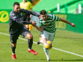 Drey Wright tries to keep Greg Taylor in check at Parkhead