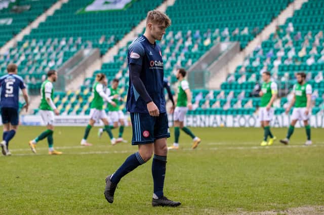 Hamilton's Jamie Hamilton is left dejected after being sent off early in the game against Hibs at Easter Road. Photo by Craig Williamson/SNS Group