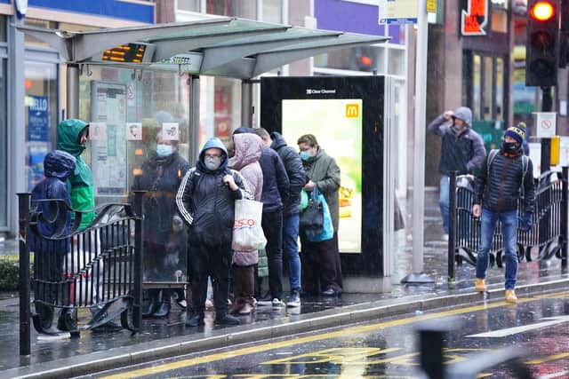 People wait for a bus in Glasgow before Storm Dudley hits the north of England/southern Scotland on Wednesday night into Thursday morning. Photo: Jane Barlow/PA Wire