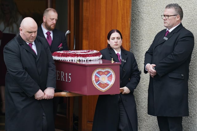 The coffin is carried from the church after the funeral of Andrew MacKinnon at St David's Church, Edinburgh.