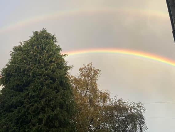 A double rainbow appears in the sky near Hayley Matthews' house
