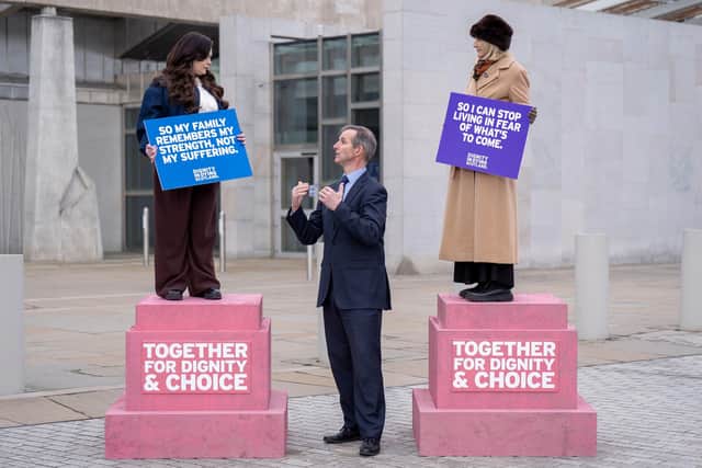 Terminally ill women Lisa Fleming (left) and Tish McEwan (right) speak with Liam McArthur MSP during a pro-assisted dying demonstration outside the Scottish Parliament yesterday