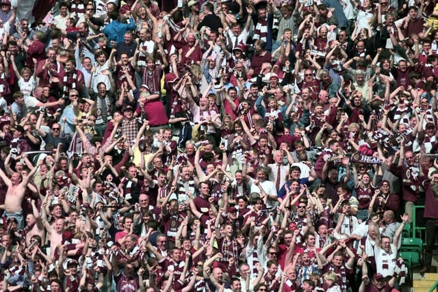 Fans celebrate as Hearts beat Rangers in the 1998 Scottish Cup final 2-1 at Parkhead to claim their first major honour since 1962.