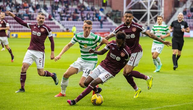 Hearts' Beni Baningime (right) holds off Celtic's David Turnbull during a cinch Premiership match between Hearts and Celtic at Tynecastle Park on Saturday. (Photo by Craig Williamson / SNS Group)