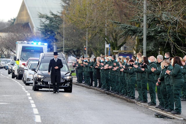 The funeral of Scottish Ambulance Service paramedic Rod Moore passed Falkirk Ambulance Station where colleagues and friends paid their respects.