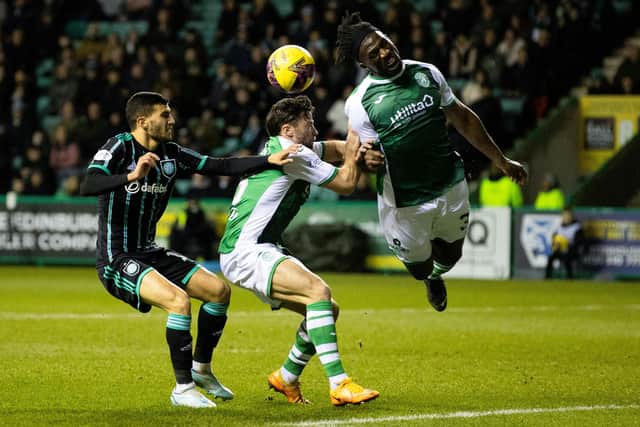 Bushiri heads the ball clear as Celtic's Liel Abada watches on during Hibs' 4-0 defeat last week