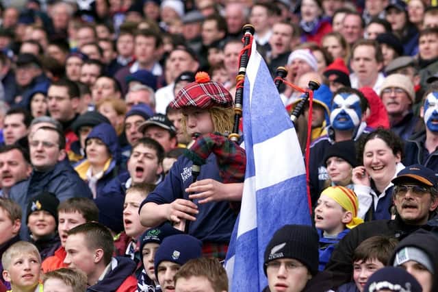 A lone piper urges the Scottish team on to Calcutta cup victory during their 19-13 win over England in April 2000 in their six nations match at Murrayfield.
