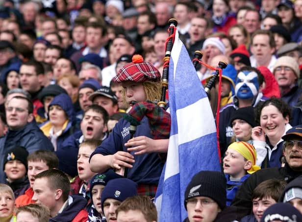 A lone piper urges the Scottish team on to Calcutta cup victory during their 19-13 win over England in April 2000 in their six nations match at Murrayfield.