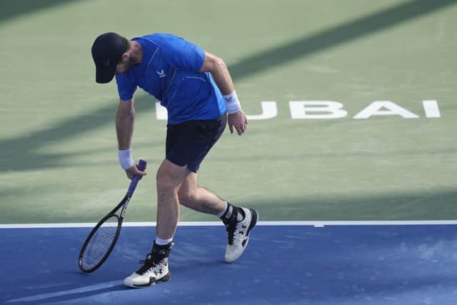 Andy Murray reacts after he lost a point agains Italy's Jannik Sinner during a match of the Dubai Duty Free Tennis Championship