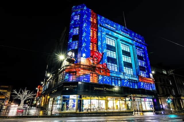 The Johnnie Walker on Princes Street has projected a magical Christmas light display across their six story building.