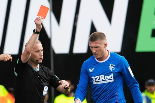 Willie Collum shows a red card to John Lundstram. Picture: Ross Parker / SNS