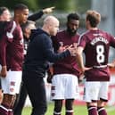 Hearts head coach Steven Naismith speaks with Calem Nieuwenhof and Beni Baningime at St Mirren. Pic: SNS