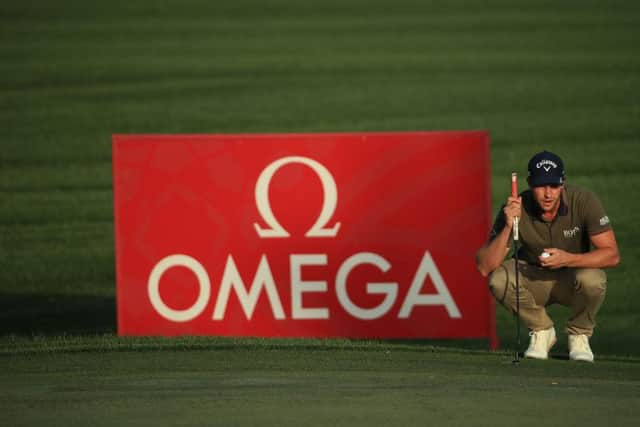 Thomas Detry lines up a putt on the seventh hole in the second round of the Omega Dubai Desert Classic at Emirates Golf Club. Picture: Andrew Redington/Getty Images.