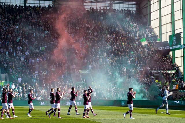 The Hearts team applaud their fans before taking on Hibs at Easter Road in April.