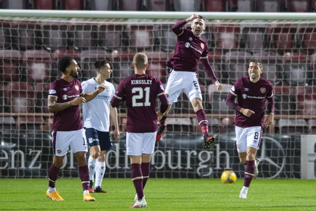 Michael Smith celebrates after opening the scoring as Hearts kick off their Championship season in style, thumping their strongest challengers for the title. Josh Ginnelly, Liam Boyce, Stephen Kingsley (twice) and Andy Halliday were also on target.