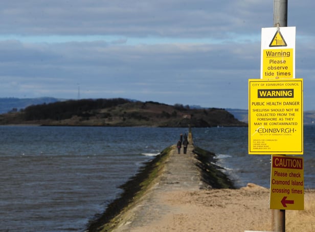 Warnings about the risk of being cut off by the tide are hard to miss on the causeway to Cramond Island (Picture: Ian Rutherford)