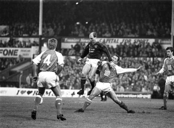 Hearts’ Eamonn Bannon beats Hibs’ Gordon Rae in the New Year’s Day Hearts v Hibs Edinburgh derby at Tynecastle in January 1990. Final score was 2-0 to Hearts.