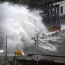 Waves crash over the harbour on Thursday in Stonehaven