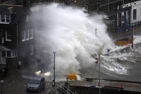 Waves crash over the harbour on Thursday in Stonehaven