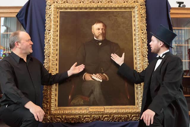 Andrew Carnegie’s great-great-great grandson Joe Whiteman (right) and Ian Hammond Brown, writer of Carnegie the Star Spangled Scotchman, sing one of the songs from the show to the portrait of Andrew Carnegie. Pic: ASM Media & PR