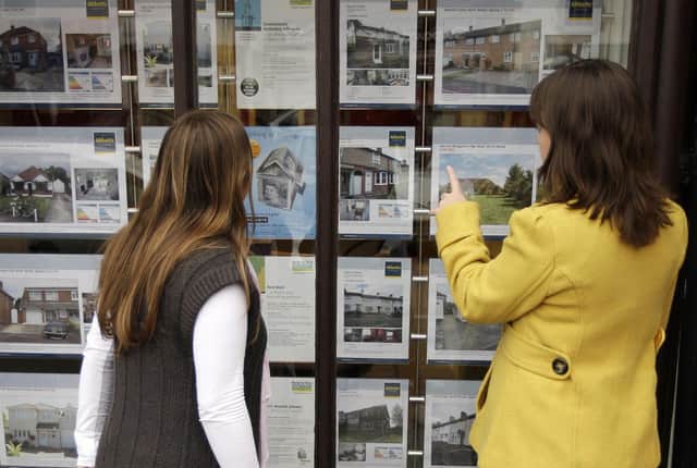An estate agents window display is pictured in Epping in Essex, in south-east England on October 14, 2008. British estate agents are selling less than one property a week as a lack of mortgage finance hits the number of people moving house, fueling plummeting prices, a surveyors' body said Tuesday. AFP PHOTO/Shaun Curry  (Photo credit should read SHAUN CURRY/AFP via Getty Images)