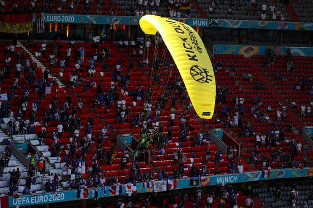 A Greenpeace protester flew into the stadium ahead of France vs Germany at Euro 2020. Photo: Getty Images