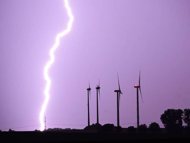 Thunder and lightning may hit Edinburgh this week, as unsettled weather continues. (Photo credit: Julian Stratenschulte/dpa via AP)