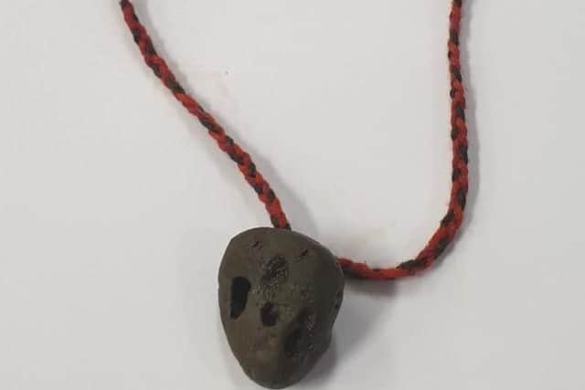 A stone-like necklace was found.