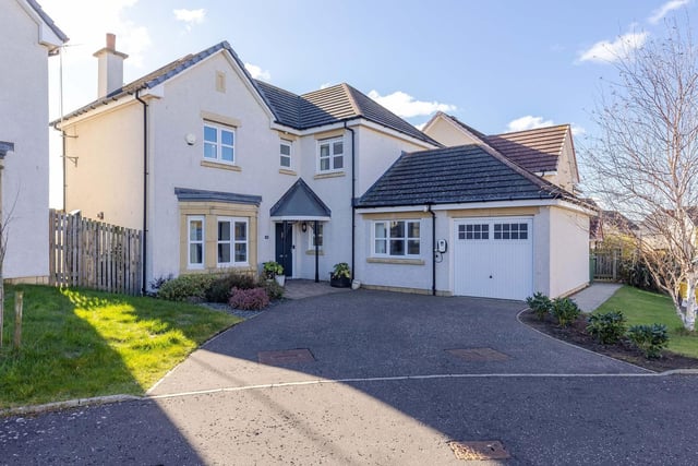This five bedroom home comes with an electric car charging point situated at the front of the garage, and private front and back gardens.