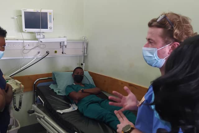 Nurse John Ivrine helps patients in Malawi.